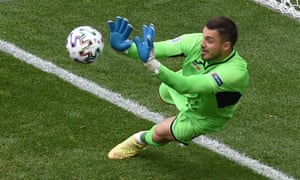 Ukraine’s Georgi Bushchan saves a penalty taken by North Macedonia’s Ezgjan Alioski before Alioski scored their first goal from the rebound.
