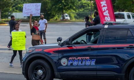 Protesters gather at the scene where a black man was shot dead by Atlanta police. 