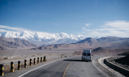 Road after crossing the Pakistan-China border. Pamir mountains in the distance.