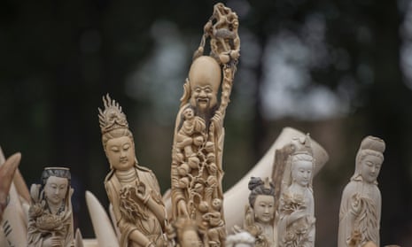 Carved ivory being shown to the media before being destroyed in Beijing.