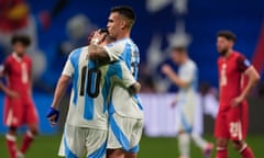 Argentina's Lautaro Martinez, right, embraces teammate Lionel Messi at the end of Thursday’s game.
