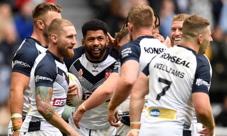 England’s Kallum Watkins (centre) celebrates with team-mates after scoring a try.