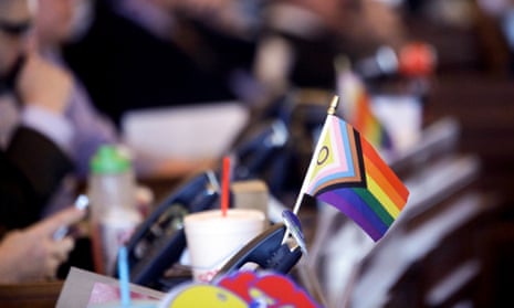 A flag supporting LGBTQ+ rights decorates a desk on the Democratic side of the Kansas house of representatives.