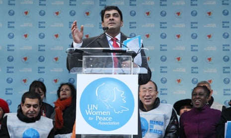 Ravi Karkara speaks before a march for gender equality and women’s rights on International Women’s Day 2015