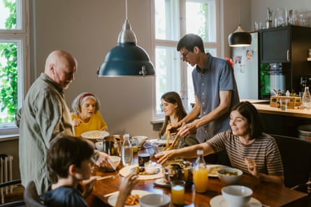 A family of different generations sitting around a dining table