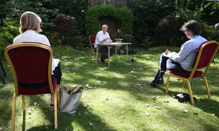 Dominic Cummings (C) speaks as he delivers a statement with journalists sat at a distance in the Rose Garden at 10 Downing Street on 25 May 2020.