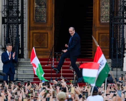 Prospective minister of health Zsolt Hegedus dances on the steps of the parliament building next to newly sworn-in prime minister Peter Magyar.