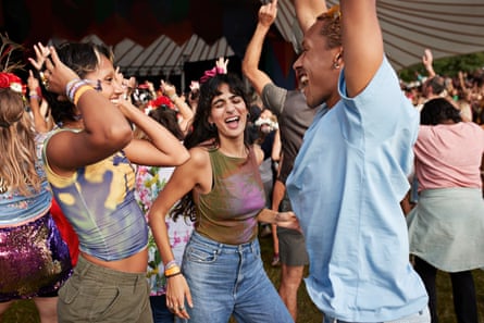 Young people dance in a tent without a phone in sight