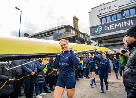 Oxford University rowers carry boat