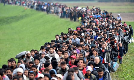 Thousands of migrants across the border between Croatia into Slovenia.