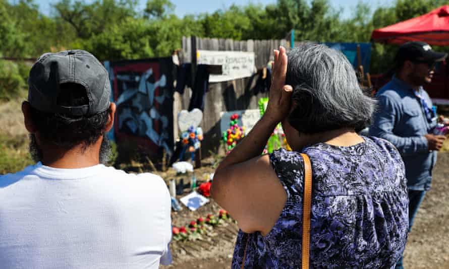 People visit a memorial on Wednesday for the victims found in a truck in San Antonio, Texas.