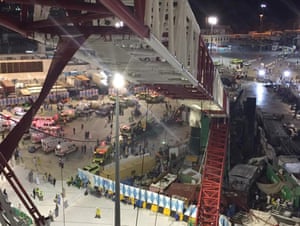A collapsed crane and emergency services vehicles are seen near the Grand Mosque in Mecca.