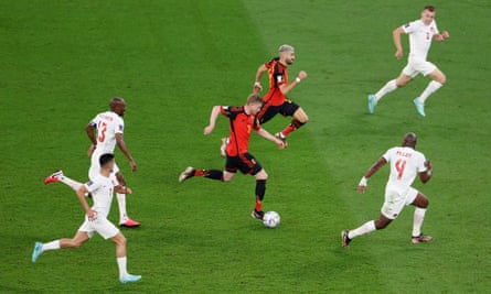 Belgium’s Kevin De Bruyne surges forward away from Canada’s Kamal Miller and Atiba Hutchinson during their World Cup 2022 match.