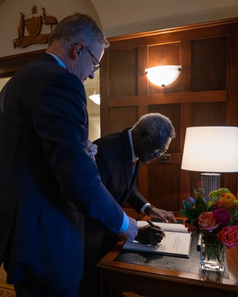 Manasseh Sogavar signs the guest book at The Lodge.