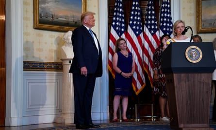 Donald Trump listens as Cleta Mitchell speaks at the White House on 18 August 2020.