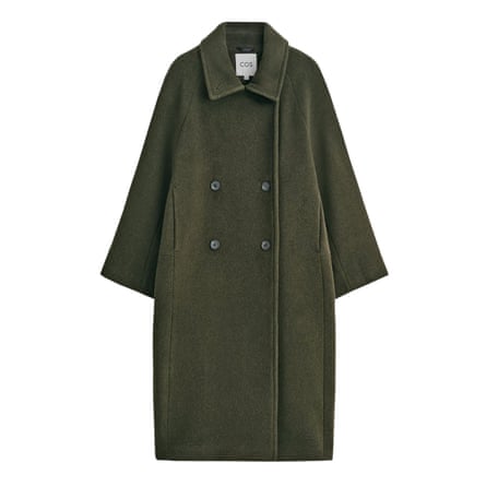 A long dark green double-breasted coat on a white background