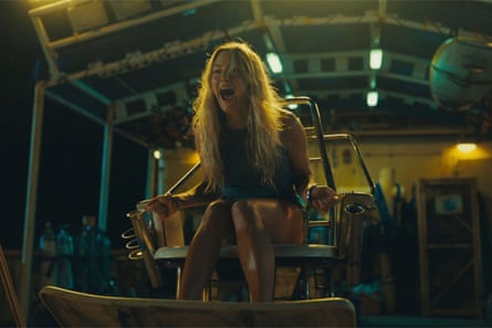 Hassie Harrison chained to a chair, screaming