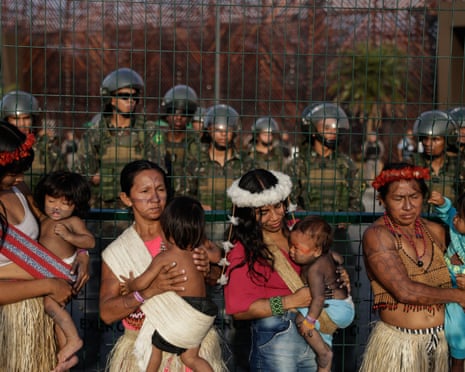 A group of indigenous protesters block the entrance to COP30