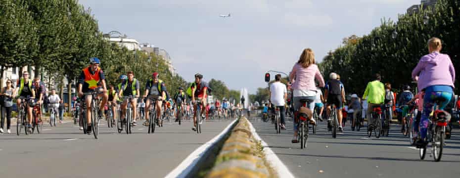 People ride bicycles on a main avenue in downtown Brussels during the annual car-free day in September 2016.