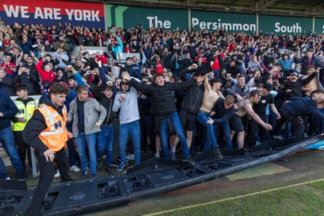 Fans celebrating the late winner led to the collapse of the advertising boards.