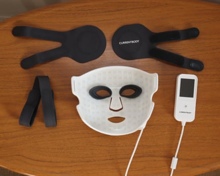 CurrentBody Series 3 LED face mask, eye attachments, controller and straps on a table
