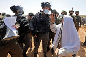 Yatta, West Bank. A Palestinian demonstrator argues with Israeli troops during a protest against Israeli settlements