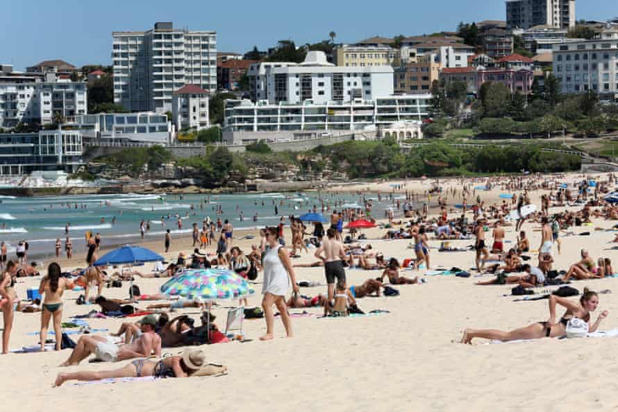 Beachgoers are seen at Bondi Beach despite the threat of Coronavirus (COVID-19) in Sydney, Friday, March 20, 2020.