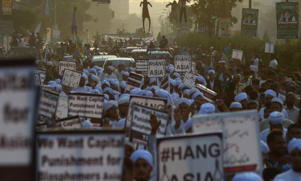Islamist activists carry placards against Asia Bibi, a Pakistani Christian woman