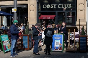 People are seen waiting to be seated in outdoor entertainment venues on 12 April, 2021 in Manchester, England.