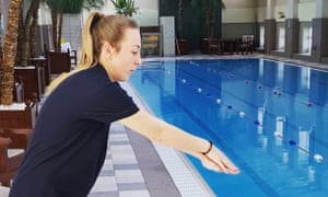 A Turner Swim coach teaching adults