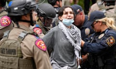 A woman is arrested at a pro-Palestinian protest at the University of Texas in Austin,