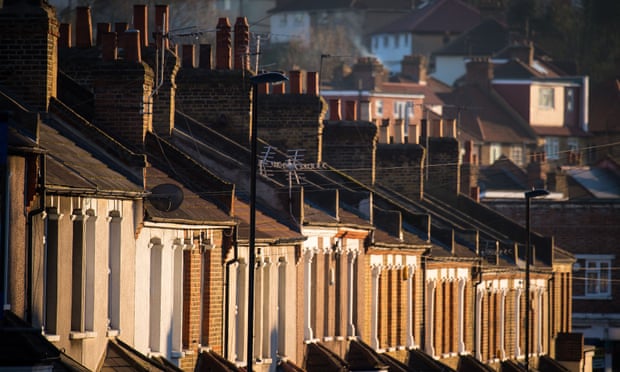A row of terraced houses bask in the evening sun