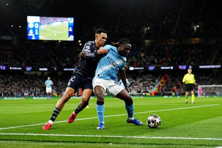 Manchester City’s Jérémy Doku (right) looks to shield the ball from Real Madrid’s Trent Alexander-Arnold during their Champions League meeting in March