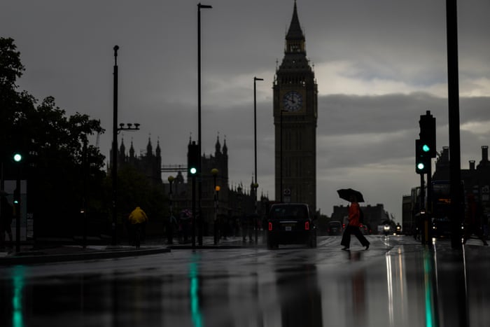People crossing Westminster Bridge Road in London today, around the time Liz Truss was making her speech on energy policy in House of Commons nearby.