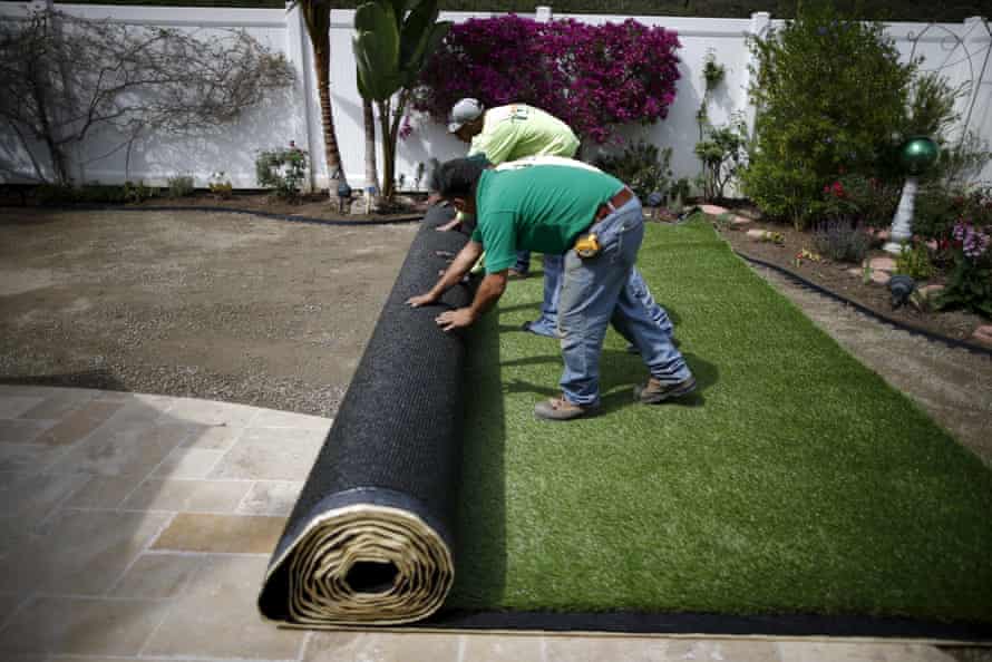 Artificial turf is rolled out after digging up a lawn due to California suffering its worst dry spell in 1,200 years