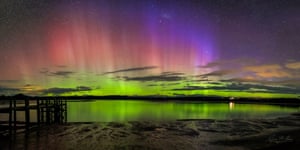 Aurora australis and satellites at sunset