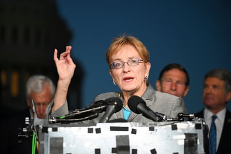 a woman speaks into a microphone