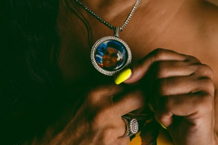 Sonya Mitchell holds a necklace containing a portrait of ‘DaDa’ Ferguson.