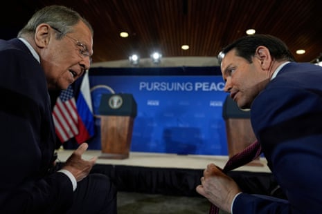 Russia's foreign minister Sergei Lavrov (L) and the US secretary of state Marco Rubio (R) talk during the Trump-Putin Alaska summit on Friday.