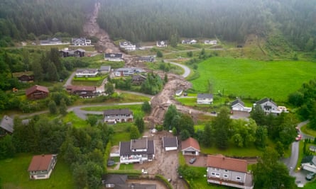 Mud and logs are washed down a slope hitting several residential buildings in Bagn, near Valdres, Nord Aurdal, Norway