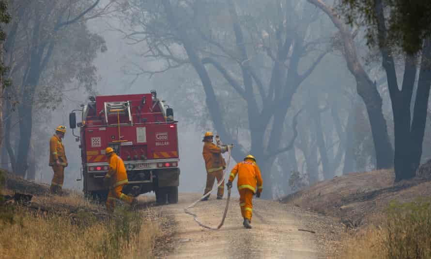Firefighters attempting to contain a bushfire near Scotsburn on Sunday.