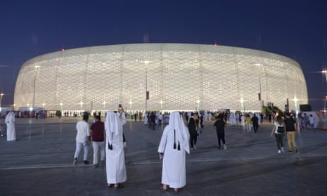 Fans gather outside the Al Thumama Stadium in Doha. The stadium is one of eight which will host the World Cup in 12 months’ time.
