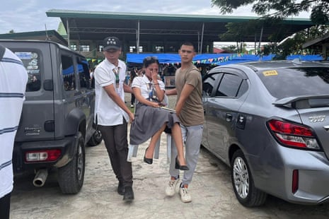 Students gathering outside the school buildings after an earthquake in Davao de Oro, Mindanao