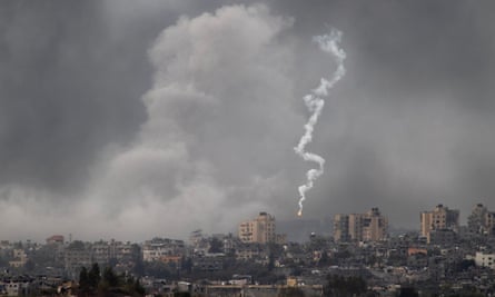 Israeli flare in smoke-filled sky