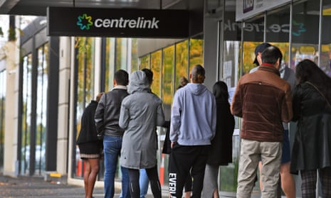 People queue up outside a Centrelink office in Melbourne on April 20, 2020