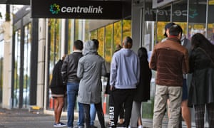 People queue outside a Centrelink office in Melbourne in April