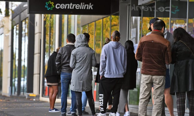 People queue outside a Centrelink office during the pandemic