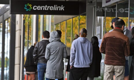 People queue at a Centrelink office in Melbourne 