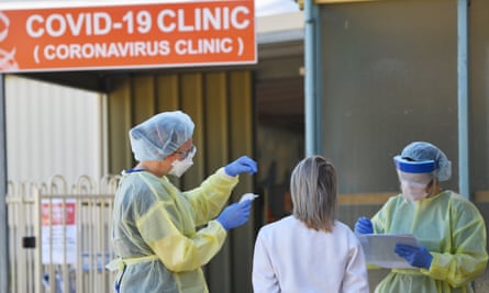 Hospital staff stand outside the Tanunda War Memorial Hospital clinic, a dedicated Covid-19 testing clinic to deal with the expected uptick in cases, in the Barossa Valley, South Australia.
