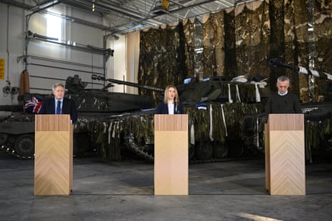 Boris Johnson (left) with Kaja Kallas (centre) and Jens Stoltenberg at the Tapa Army Base in Tallinn, Estonia.